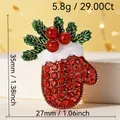 Sparkling Christmas mitten brooch with red crystals and festive green holly leaves design - Holly Berry Glove (111)