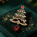 Elegant Christmas tree brooch featuring a red teardrop crystal on green velvet - Red & Green Rhinestone Christmas Tree (118)