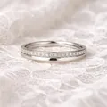 Elegant silver ring set with sparkling D color moissanite stones placed on white lace - US Size 4.5 / Minimalist Moissanite Half-Band Ring / Silver