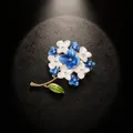 Macro detail of elegant enamel hydrangea brooch with shimmering rhinestone centers - Sky Blue