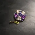 Close-up of elegant hydrangea brooch with purple enamel petals and sparkling crystals. - Violet