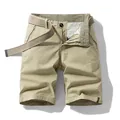 Retro men's khaki cargo shorts featuring a woven belt and checkered inner waistband - 29 / Bottoms / Khaki