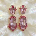 Elegant vintage gold-tone earrings featuring large purple gems and pink crystal accents - Amethyst Vintage Earrings (2608177A) / Purple