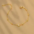 Élégant bracelet en acier inoxydable doré avec une chaîne perlée et un charme fleur en zircon - Style Étoile (B0016)