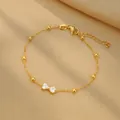 Bracelet élégant en acier inoxydable doré avec nœud en zircon et perles pour femmes - Style Nœud (B0018)