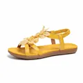 Yellow Bohemian flat sandals with floral embellishments and cross straps for beach - Yellow
