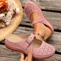 Detailed view of pink hollow-out platform clogs with buckle strap for summer leisure wear - 36 / Pink