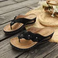 Elegant black wedge thong sandals for women with floral accents and contrast stitching details - 36 / Black
