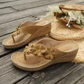 Elegant tan wedge thong sandals featuring stylish floral decorations and retro stitching details - 36 / Khaki
