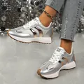 Detailed side view of silver platform sneakers with metallic accents and brown lug soles. - 36 / Silver