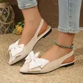 Elegant beige pointed-toe flat sandals featuring a large bow detail and comfortable slingback strap - 35 / Off White