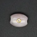 Close-up of pink strawberry quartz barrel bead with a central sparkling zircon inlay - Rose Quartz