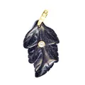 Close-up detail of blue goldstone leaf pendant with sparkling texture and central zircon - Blue Sandstone