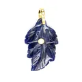 Detailed view of a small natural blue stone leaf pendant with gold zircon inlay. - Blue Sodalite