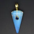 Detailed view of a hexagonal opalite cone pendant with a blue gemstone inlay. - Opal