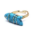 Close-up of handmade wire-wrapped ring featuring a carved turquoise-colored fish stone. - Fish Shaped Carving (aljylr2064) / Blue Turquoise