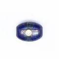 Macro view of blue natural stone barrel bead with inlaid sparkling zircon detail - Lapis Lazuli