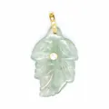 Macro view of light green natural stone leaf pendant with central zircon inlay - Green Fluorite