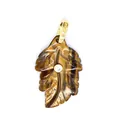 Close-up detail of a natural tiger's eye stone leaf pendant with golden bail and zircon inlay - Tiger's Eye