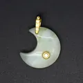 Detailed close-up of a moon-shaped natural stone pendant with an elegant gold zircon-set clasp - Xinschan Jade