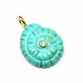 Detailed close-up carving of a turquoise conch shell pendant with a central zircon stone. - Turquoise