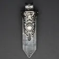 Macro detail of vintage floral silver carving on a clear crystal hexagonal pendant - White Crystal