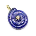 Close-up of carved lapis lazuli spiral shell pendant with central zircon detail. - Lapis Lazuli