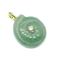 Detailed macro view showing the carved green stone snail shell pendant with zircon inset - Aventurine Jade