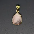 Macro view of a teardrop faceted pink natural stone pendant with a polished gold bail - Rose Quartz
