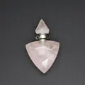 Detailed macro shot of a faceted rose quartz triangular essential oil bottle pendant - Rose Quartz / Silver