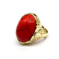 Macro view of a large faceted red stone ring with gold setting and adjustable open band - Red Pine Stone