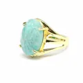 Macro view of a French vintage 13x18mm oval light blue stone ring with gold plated band - Amazonite
