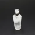 Close-up of clear quartz perfume bottle pendant with faceted crystal cap and silver loops. - White Crystal / Silver