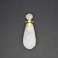 Detail view of a white quartz teardrop essential oil diffuser bottle necklace pendant. - Clear Quartz-Gold
