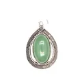 Detail view showing a green oval crystal stone teardrop pendant with patterned silver frame - Aventurine Jade