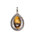 Elegant vintage teardrop tiger eye pendant with an intricate silver textured frame - Tiger's Eye