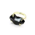 Close-up of raw black crystal ring with gold-plated claw setting and adjustable band - Obsidian