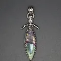 Close-up of a sword-shaped pendant featuring faceted natural stone and ornate silver detailing - Fluorite