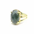 Close-up of vintage gold ring with large oval faceted green natural stone - India Agate