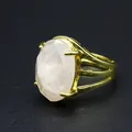 Close-up of vintage gold-plated open ring featuring a large faceted oval natural stone. - Rose Quartz
