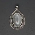 Close-up detail of an elegant teardrop crystal pendant featuring a textured silver-tone frame - White Crystal