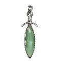 Macro view of a vintage silver sword-shaped pendant with faceted green natural stone inlay - Aventurine Jade