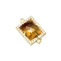 Macro detailed shot of a rectangular gold-plated copper CZ jewelry connector charm - Tiger Eye (aljylp1952)