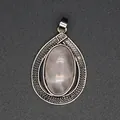 Close-up of vintage teardrop silver pendant with oval pink crystal stone - Rose Quartz