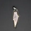 Detailed view of vintage rose quartz lightning bolt pendant with beaded metal frame - Rose Quartz