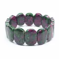Macro view of polished Ruby Zoisite oval stones in a natural crystal bracelet - Hand Plate Style / 11x18mm / Ruby Zoisite