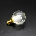Close-up of 16mm clear quartz essential oil bottle pendant with gold cap on black background - Gold Cap / 16mm / White Crystal