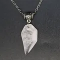 Close-up of faceted natural rose quartz pendant with decorative silver chain bead - Rose Quartz