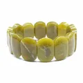 Close-up detail shot of polished oval yellowish-green natural stone beaded stretch bracelet - Hand Plate Style / 11x18mm / Southern Jade