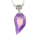 Close-up detail of a faceted purple natural fluorite crystal pendant on a silver chain - Amethyst